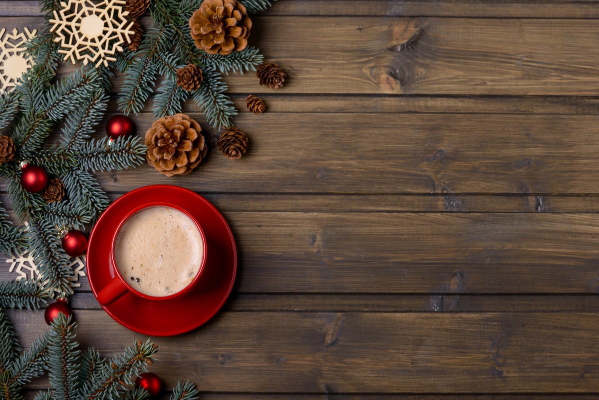 A red cup full of coffee on a wood table in Nevada.