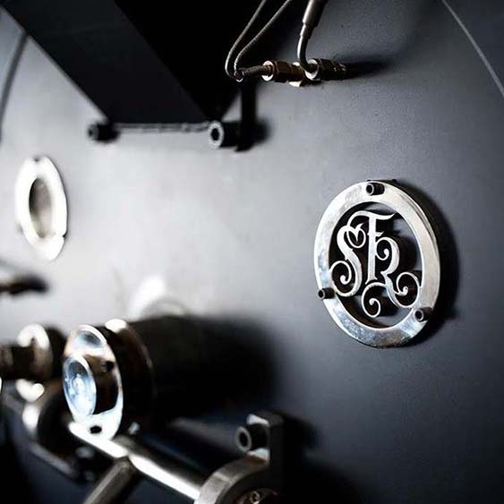 close-up of large coffee roasting machine